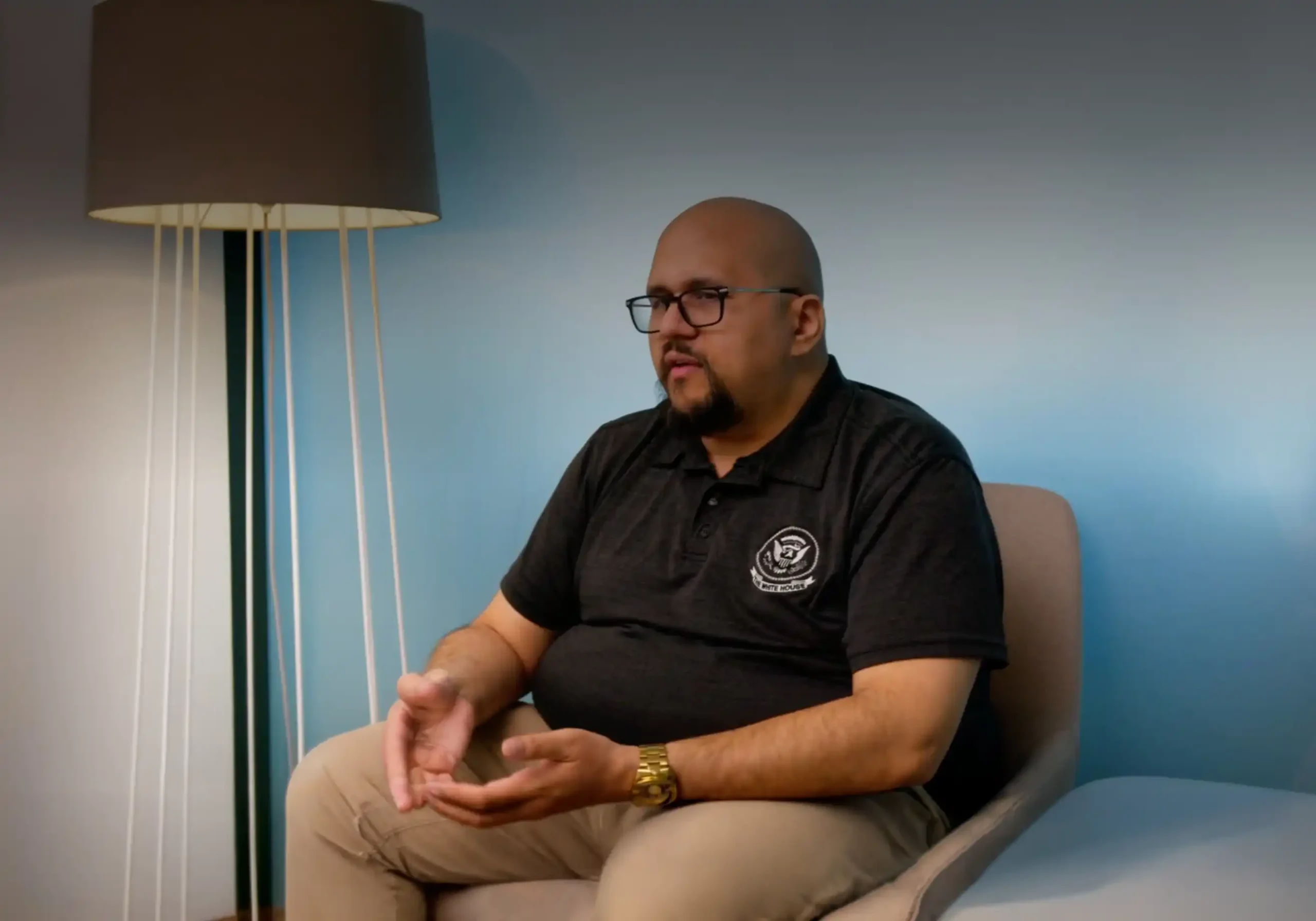 Image of Cody Hart talking in a chair